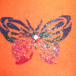 'Butterfly' Glitter Tattoo with rhinestone accent. 'Butterfly' Glitter Tattoo with rhinestone accent.